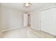Bedroom featuring carpeted floors, a ceiling fan, and a closet with sliding doors at 10669 Springston Ct, Fishers, IN 46037