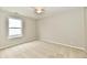 Bedroom featuring carpeted floors, neutral walls, a ceiling fan, and a window at 10669 Springston Ct, Fishers, IN 46037
