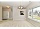 Inviting dining area filled with natural light, showcasing a seamless flow into the entryway and an open view into the kitchen at 10669 Springston Ct, Fishers, IN 46037