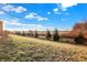 Serene view of the expansive backyard, showcasing mature trees and a glimpse of the neighborhood landscape at 1083 Margate Dr, Greenwood, IN 46143