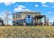 Expansive backyard with a covered pergola and large windows offering ample natural light and backyard views at 1083 Margate Dr, Greenwood, IN 46143