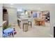 Finished basement featuring a bar area, game table, and playful decor provides versatile space for entertaining and recreation at 1083 Margate Dr, Greenwood, IN 46143