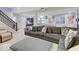 Finished basement boasts cozy seating, a kitchenette, and a staircase, creating a comfortable and functional living space at 1083 Margate Dr, Greenwood, IN 46143