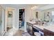 This bathroom features a vanity and a walk-in closet for added storage and convenience at 1083 Margate Dr, Greenwood, IN 46143