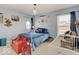 Decorated bedroom with unique star light fixture and Harry Potter themed decor; crib and childs chair included at 1083 Margate Dr, Greenwood, IN 46143