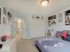 Bright bedroom with themed decorations and a closet featuring paneled doors, neutral carpet and -themed decorations at 1083 Margate Dr, Greenwood, IN 46143