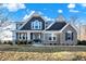 Charming two-story home with a combination of brick and siding, accented by a well-manicured lawn at 1083 Margate Dr, Greenwood, IN 46143