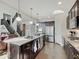 Stylish kitchen featuring a central island, stainless steel appliances, and dark wood cabinetry, great for cooking at 1083 Margate Dr, Greenwood, IN 46143