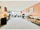 Spacious carpeted living room with two-tone walls, white shelving, and natural light from multiple windows at 1083 Margate Dr, Greenwood, IN 46143
