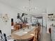 Open concept living space seamlessly connects the dining area to the modern kitchen for easy entertaining and Gathering living at 1083 Margate Dr, Greenwood, IN 46143