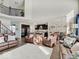 Open concept living space with views of kitchen and dining, with comfortable seating and large bright windows at 1083 Margate Dr, Greenwood, IN 46143