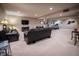 Spacious finished basement offers a cozy seating area, large TV, and workout equipment at 12991 Pennington Rd, Fishers, IN 46037