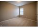 Bright, carpeted bedroom features neutral walls and trim, plus a window with blinds for natural light at 12991 Pennington Rd, Fishers, IN 46037