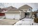 Charming home featuring a two-car garage, covered porch, neutral siding and well-maintained landscaping at 12991 Pennington Rd, Fishers, IN 46037