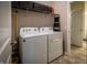 Functional laundry room featuring a side-by-side washer and dryer for efficient laundry care at 12991 Pennington Rd, Fishers, IN 46037