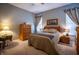 Serene bedroom with carpet, complemented by light-filled windows and neutral tones at 12991 Pennington Rd, Fishers, IN 46037