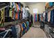 Organized walk-in closet features shelving and hanging space for efficient storage of clothing and accessories at 12991 Pennington Rd, Fishers, IN 46037