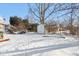 Backyard with a storage shed covered in snow, and dormant landscaping at 1390 Greenfield Ave, Noblesville, IN 46060