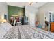 Spacious room with a bed, ceiling fan, and a doorway view into the living room at 1390 Greenfield Ave, Noblesville, IN 46060