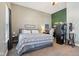 Bedroom with neutral walls, carpet flooring, and a window at 1390 Greenfield Ave, Noblesville, IN 46060