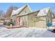 Charming home exterior with a red door and snow-covered yard at 1390 Greenfield Ave, Noblesville, IN 46060