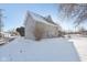 Charming home exterior featuring gray siding, and a snow-covered lawn at 1390 Greenfield Ave, Noblesville, IN 46060
