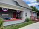 Inviting front porch with festive decorations, creating a warm and welcoming entrance to this charming home at 1390 Greenfield Ave, Noblesville, IN 46060