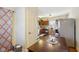 Kitchen with stainless steel appliances, wooden cabinetry, and dining area access at 1390 Greenfield Ave, Noblesville, IN 46060
