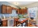 Kitchen featuring stainless steel appliances, wood cabinetry, and a view of the window at 1390 Greenfield Ave, Noblesville, IN 46060