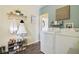Bright laundry room with modern washer and dryer, charming decor, and stylish storage solutions at 1390 Greenfield Ave, Noblesville, IN 46060
