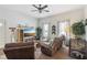 Cozy living room with a ceiling fan, modern furniture, and ample natural light at 1390 Greenfield Ave, Noblesville, IN 46060