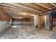 Large unfinished basement ready for customization; features wood beams and utilities at 14390 Bishop Birch Pl, Carmel, IN 46032