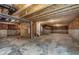 An unfinished basement space with exposed beams and concrete floor at 14390 Bishop Birch Pl, Carmel, IN 46032