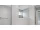 Walk-in shower with glass partition and white subway tile at 14390 Bishop Birch Pl, Carmel, IN 46032