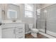 Bathroom with a shower, white vanity, and toilet at 14390 Bishop Birch Pl, Carmel, IN 46032