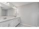 A bathroom vanity with double sinks and a large mirror at 14390 Bishop Birch Pl, Carmel, IN 46032