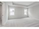An empty bedroom with carpet, neutral paint, and lots of natural light at 14390 Bishop Birch Pl, Carmel, IN 46032