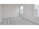Comfortable carpeted bedroom with large windows bringing in natural light at 14390 Bishop Birch Pl, Carmel, IN 46032