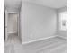 Spacious bedroom featuring soft carpet, fresh paint and entry to other rooms at 14390 Bishop Birch Pl, Carmel, IN 46032