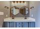 Bathroom vanity with double sinks, hexagon mirrors, and updated fixtures at 15486 Dusty Trl, Noblesville, IN 46060
