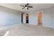 Bedroom with neutral carpet, ceiling fan, bathroom and walk-in closet at 15486 Dusty Trl, Noblesville, IN 46060