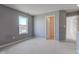 Bright bedroom with gray walls and carpeted flooring, looking towards hallway at 15486 Dusty Trl, Noblesville, IN 46060