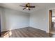 Bedroom featuring wood-look floors, a ceiling fan, with a closet nearby at 15486 Dusty Trl, Noblesville, IN 46060