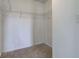 Walk-in closet with neutral carpet and multiple wire shelves at 15486 Dusty Trl, Noblesville, IN 46060