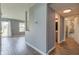 Open-concept hallway showcases modern flooring and access to multiple rooms within the home at 15486 Dusty Trl, Noblesville, IN 46060