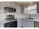 Updated kitchen featuring stainless appliances, white counters, and subway tile backsplash at 15486 Dusty Trl, Noblesville, IN 46060