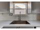 Kitchen sink and counter area with white counters and subway tile backsplash at 15486 Dusty Trl, Noblesville, IN 46060
