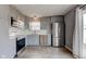 Bright kitchen with gray cabinets, stainless steel appliances, and white subway tile backsplash at 15486 Dusty Trl, Noblesville, IN 46060
