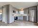 Well-lit kitchen featuring stainless steel appliances, gray cabinetry and modern finishes at 15486 Dusty Trl, Noblesville, IN 46060