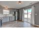Kitchen area showcasing stainless steel refrigerator and sliding door leading to backyard at 15486 Dusty Trl, Noblesville, IN 46060